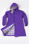 The GINGHAM ULTRAVIOLET WINDBREAKER by The Windbreaker Jacket is on display, highlighting its water-resistant features. Displayed flat on a white background with one side open, it shows the plaid lining, hood, black buttons, two front pockets, and elastic cuffs.