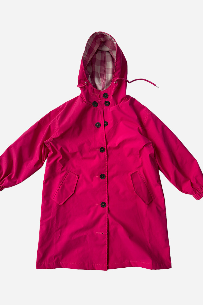 The Bright Berry Kids’ Windbreaker by looselyboho is a berry pink, water-resistant jacket with black buttons, front pockets, elastic cuffs, and a hood lined with pink and white checks, shown laid flat on a white background.