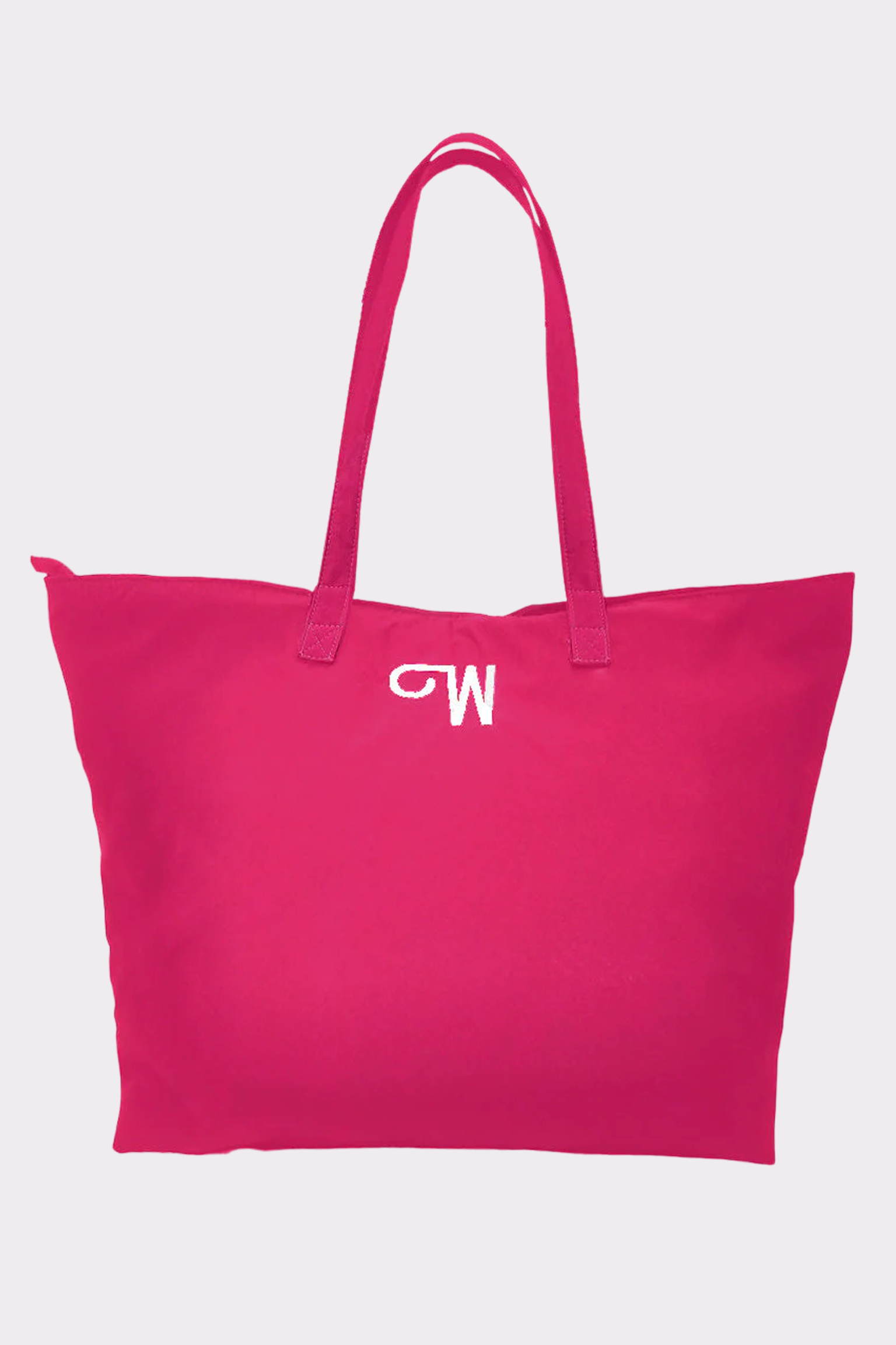 The Urban Slate Waterproof Bag is a spacious, vibrant pink travel and gym bag with two handles and a white “CW” monogram near the top, shown against a plain light background.